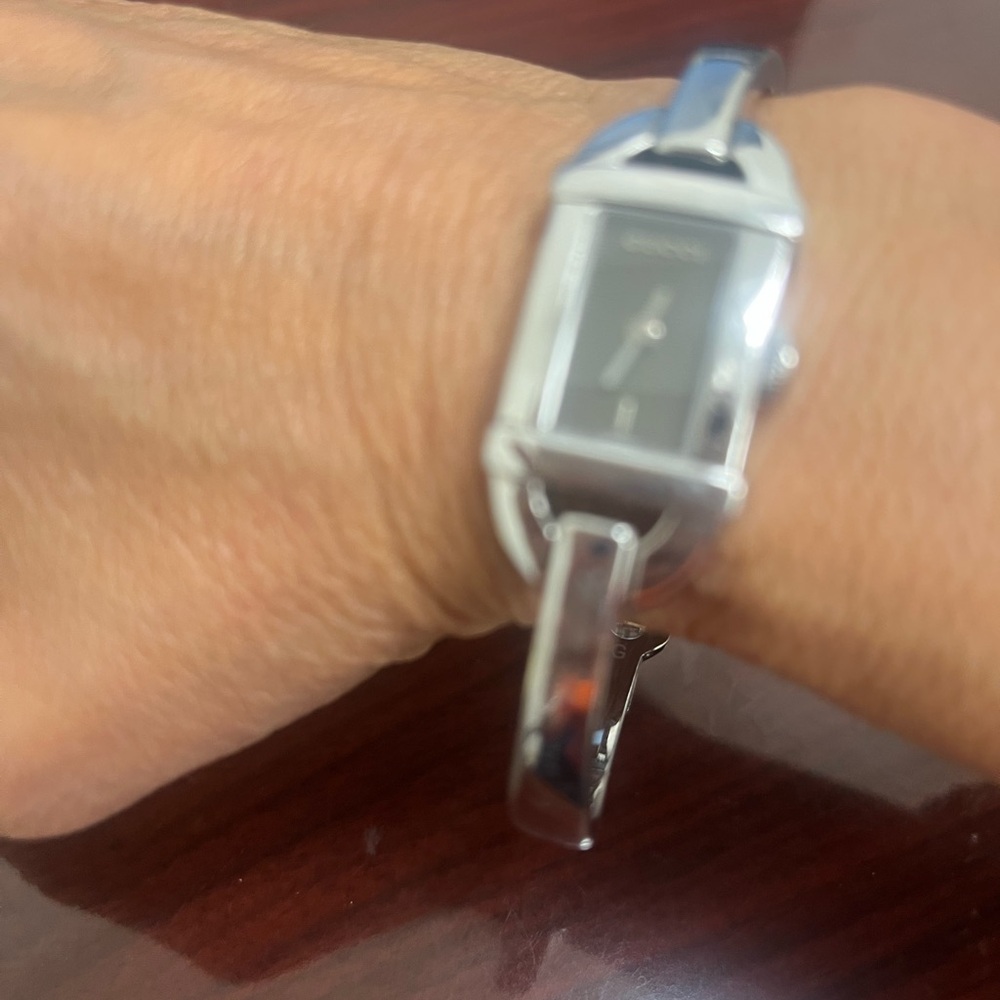 Gucci silver wrist watch.